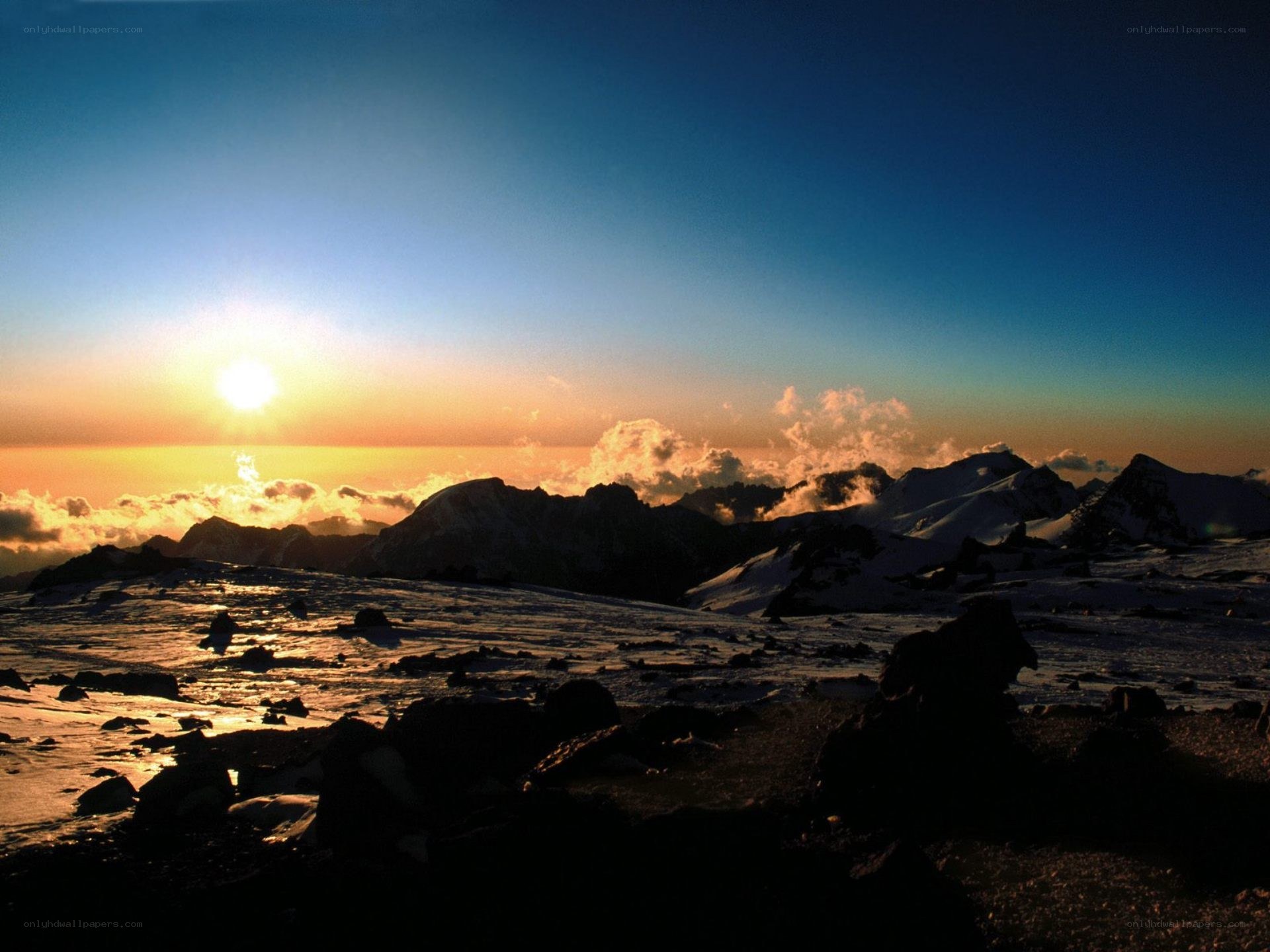 Sunrise over snow-capped mountains