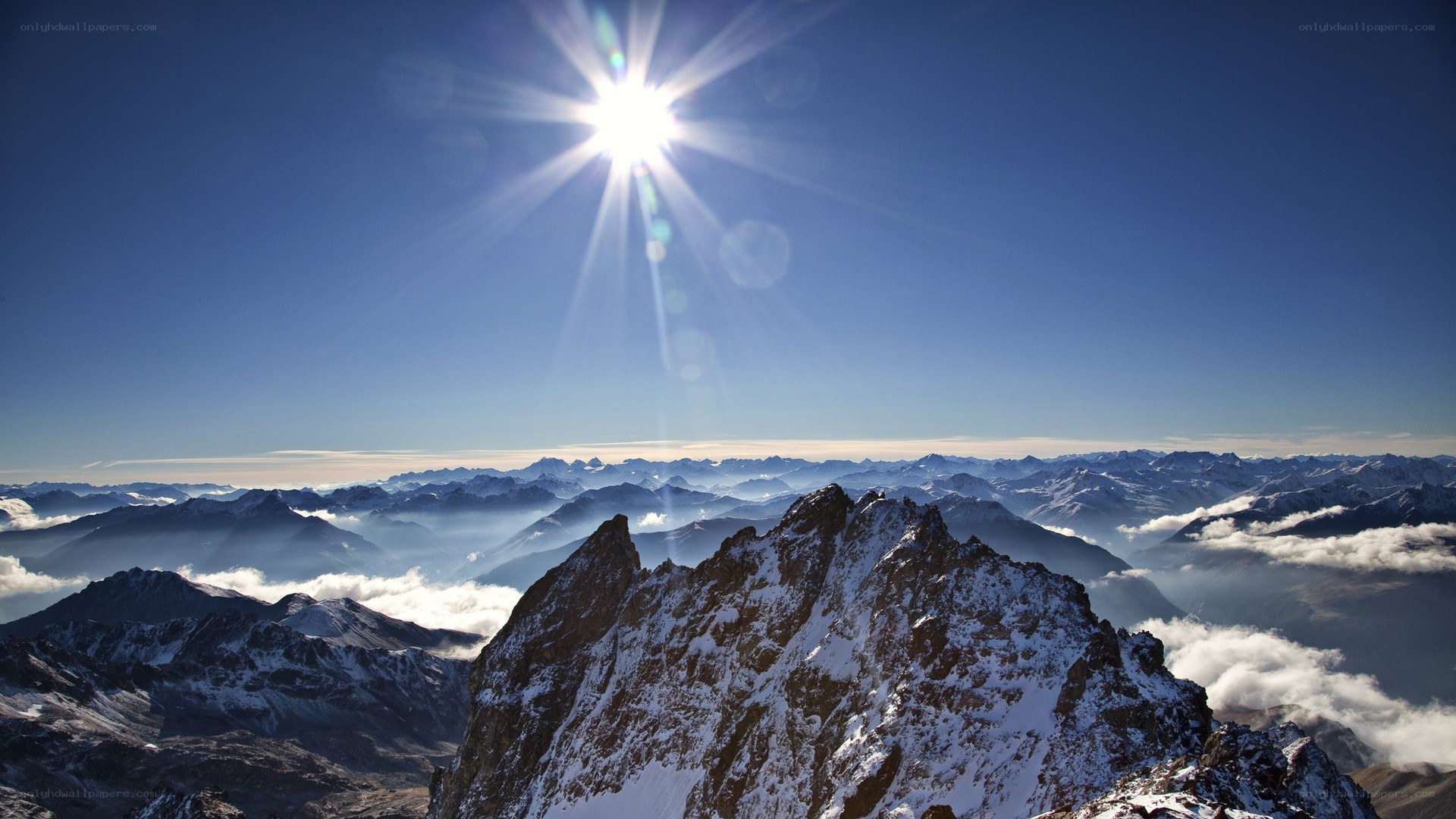 Sunrise over snow-capped mountains