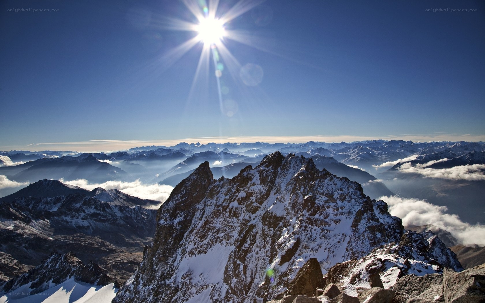 Sunrise over snow-capped mountains