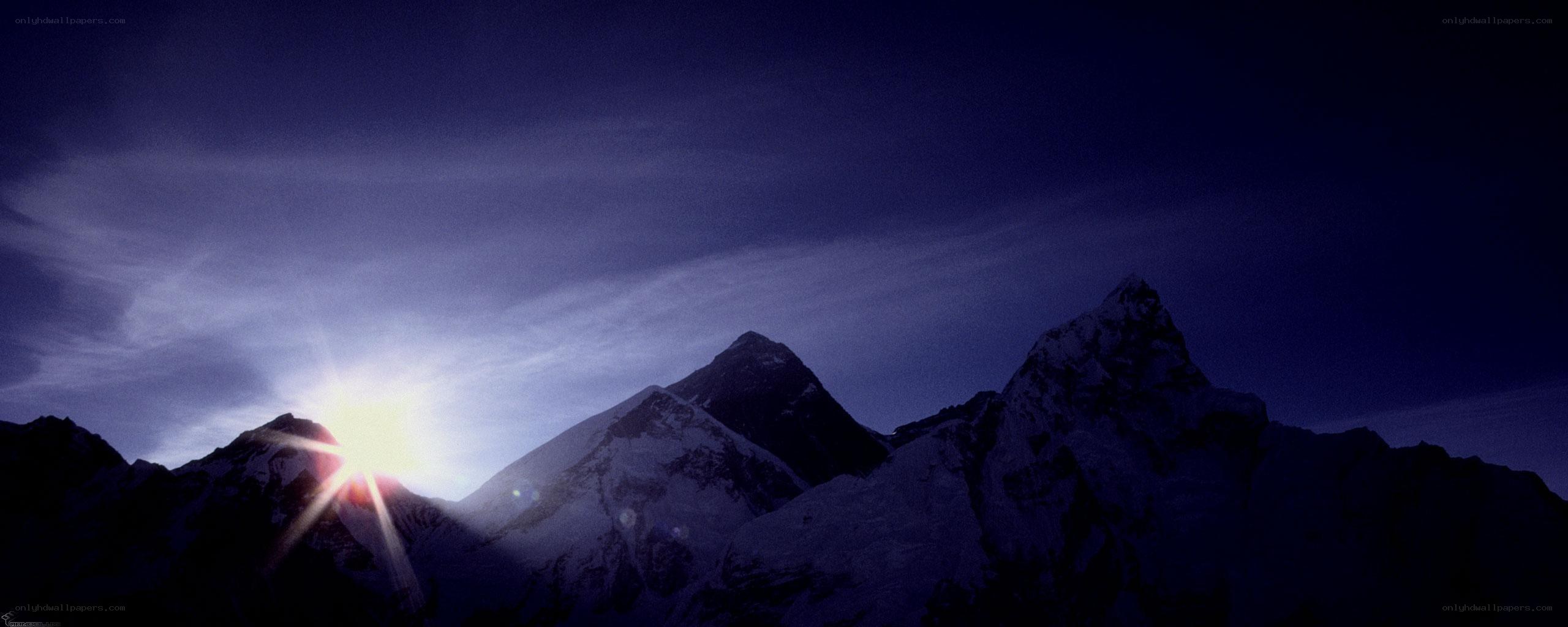 Sunrise over snow-capped mountains