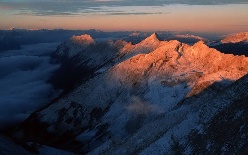 Sunrise over snow-capped mountains