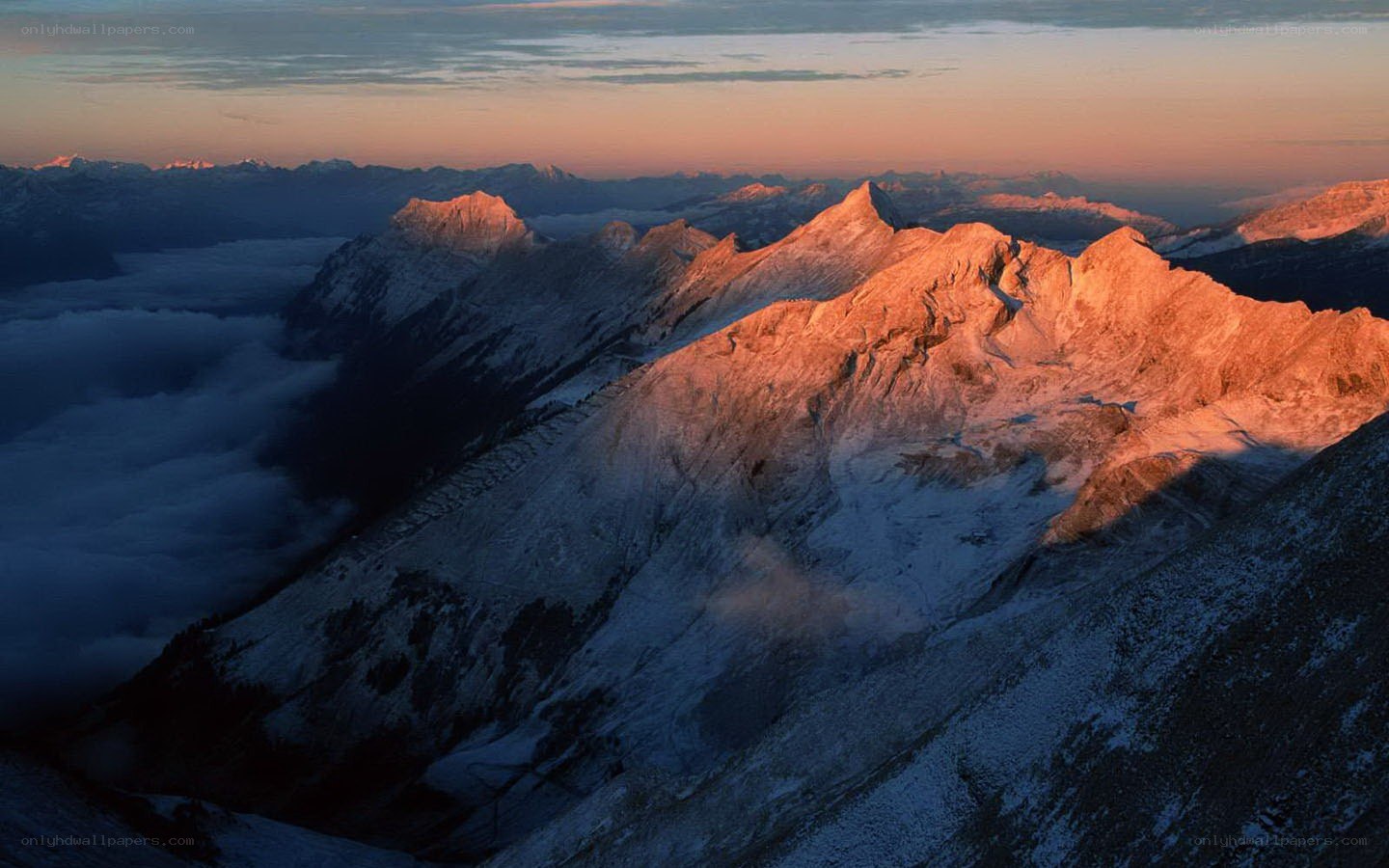 Sunrise over snow-capped mountains