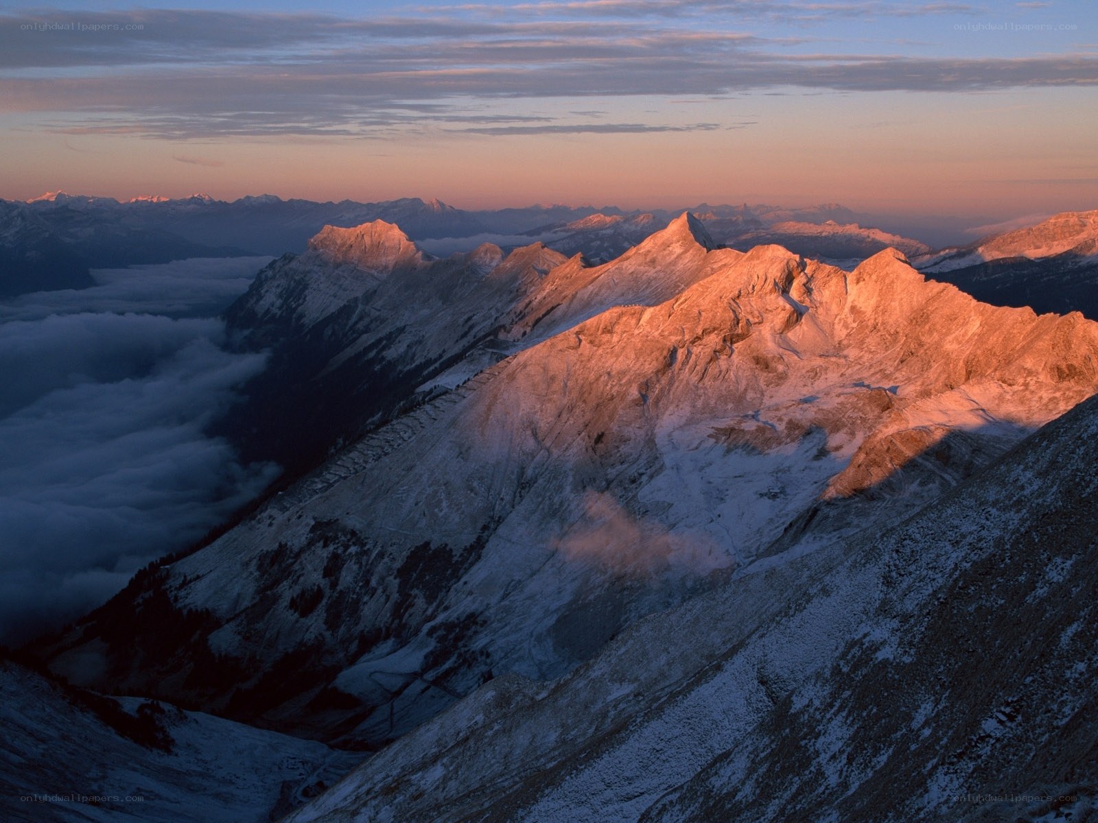 Sunrise over snow-capped mountains