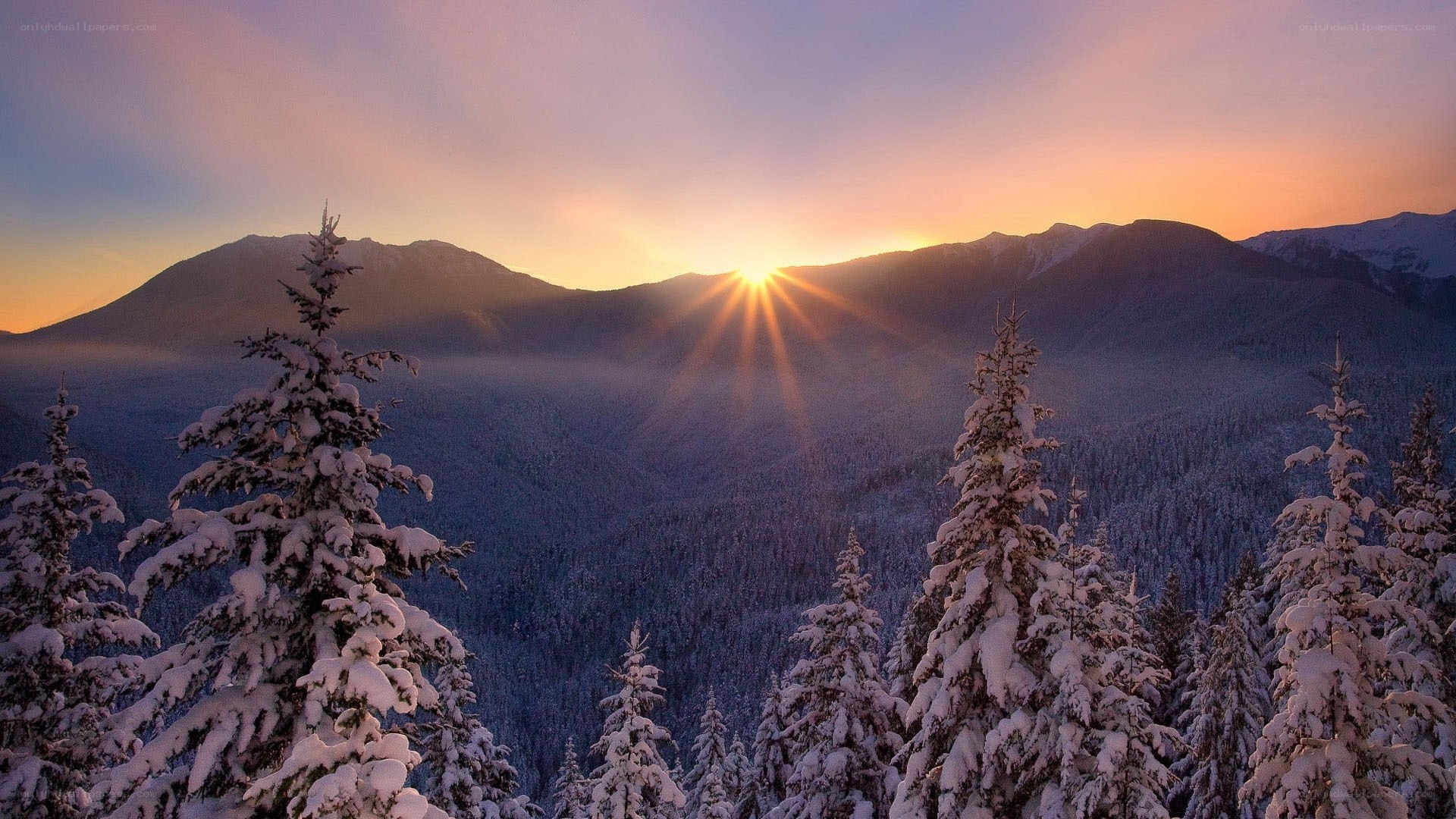 Sunrise over snow-covered mountains