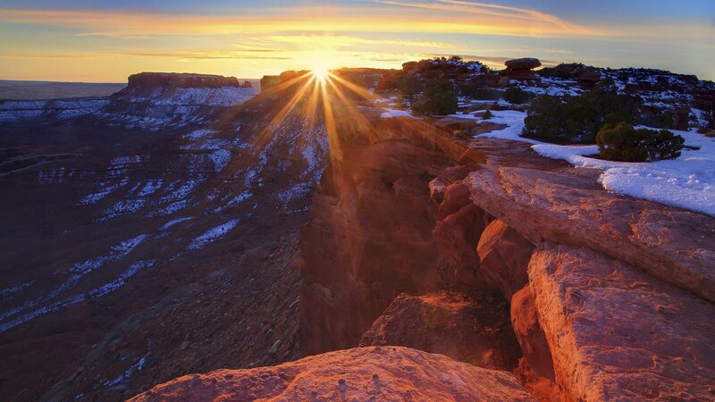 Sunrise over snowy canyon