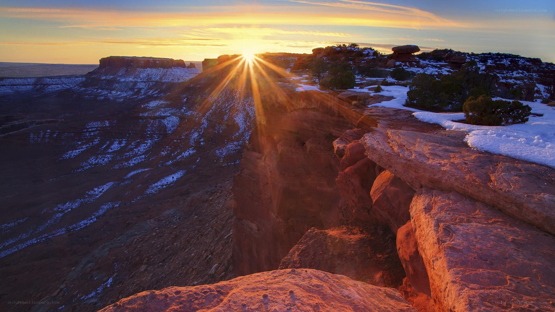 Sunrise over snowy canyon