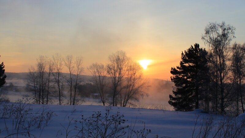 Sunrise over Snowy Landscape — Orange, Serene, Winter