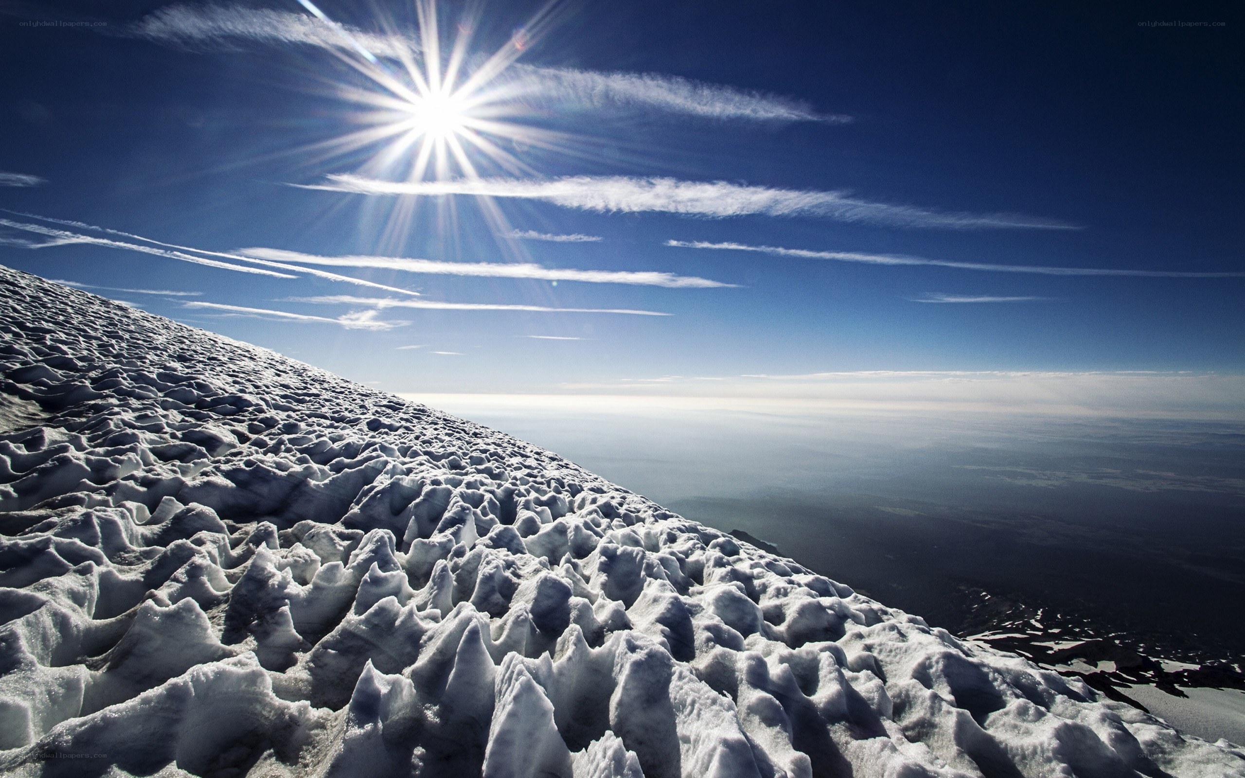Sunrise over snowy mountain peak