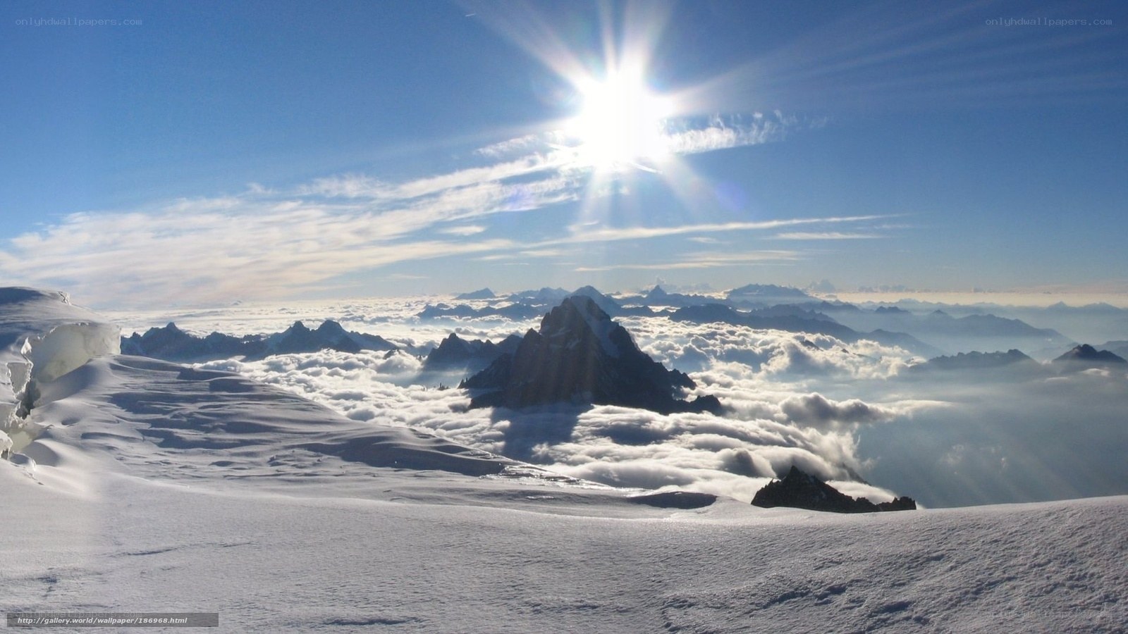 Sunrise over snowy mountain peaks