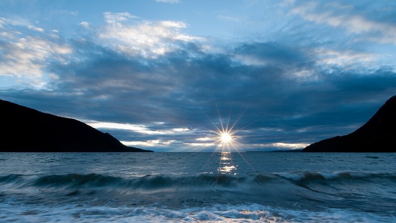 Sunrise over Water — Blue, Dramatic, Photograph, Mountains