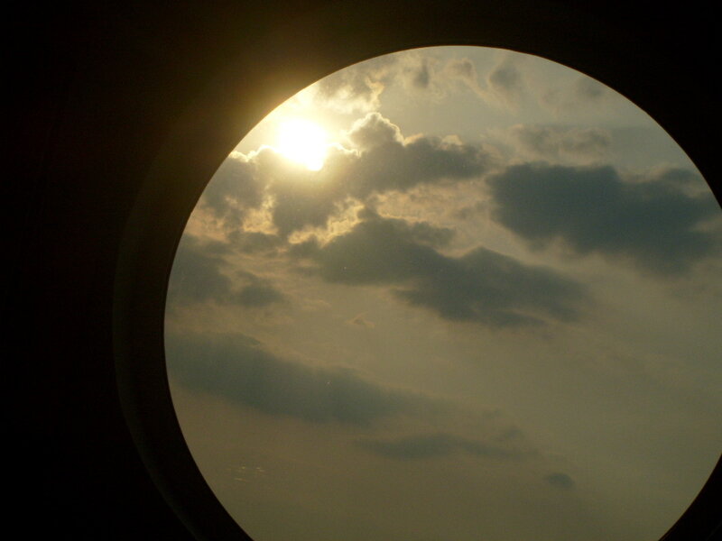 Sunrise through airplane window