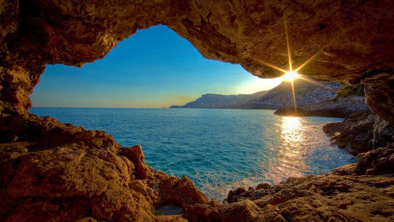 Sunrise Through Cave Opening — Blue, Serene, Photograph, Sea
