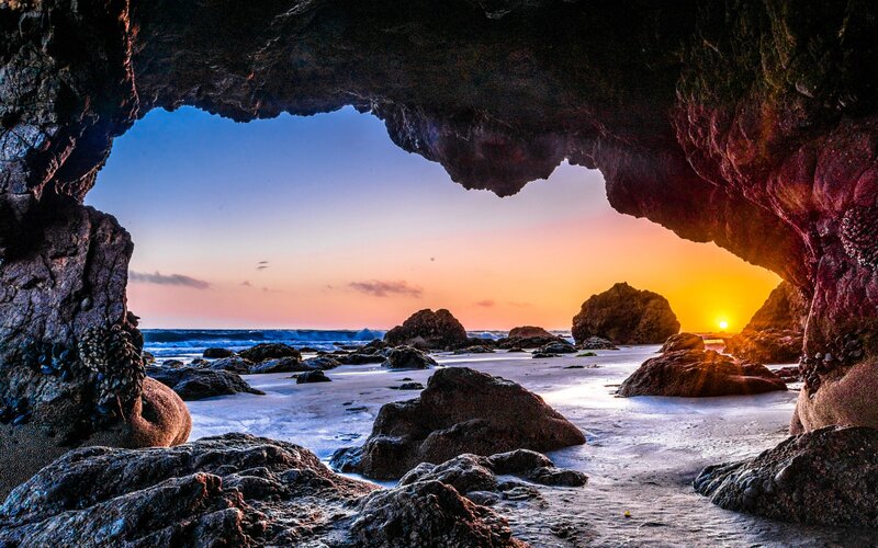 Sunrise Through Cave Opening — Orange, Serene, Photograph