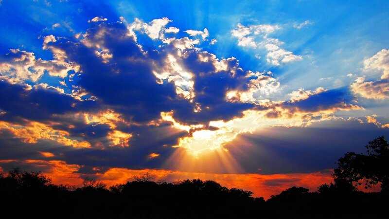 Sunrise Through Clouds — Blue, Dramatic, Photograph