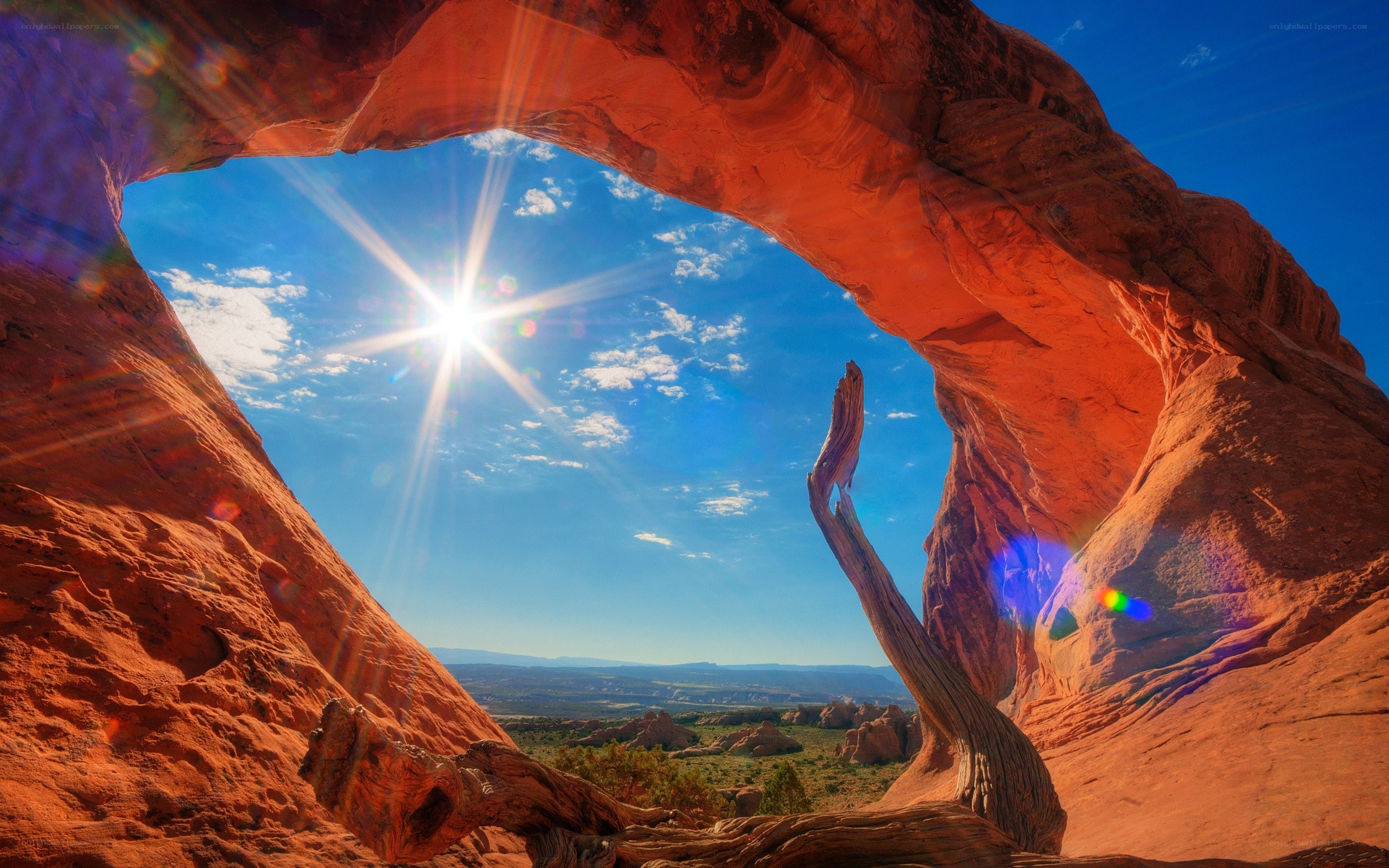 Sunrise through natural rock arch