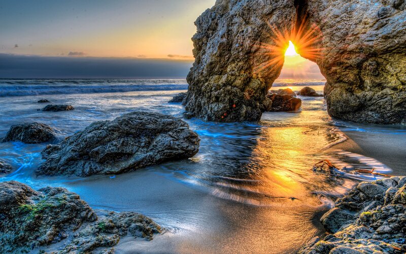 Sunrise Through Rock Arch — Blue, Dramatic