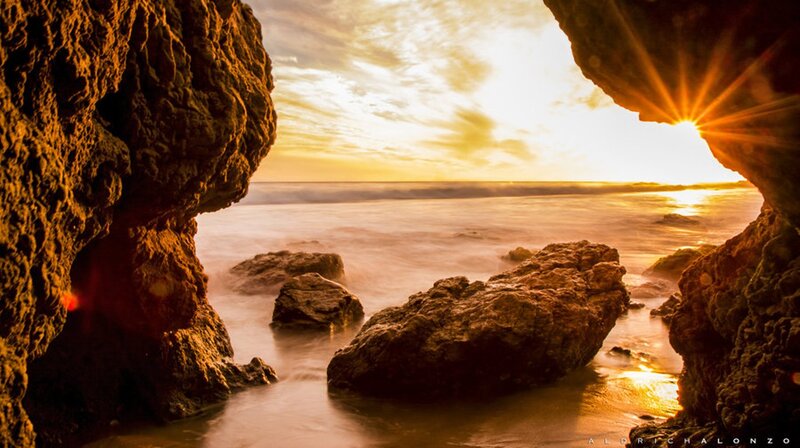 Sunrise Through Rock Arch — Gold