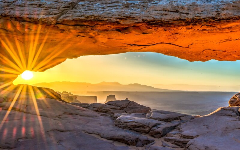Sunrise Through Rock Arch — Orange, Serene