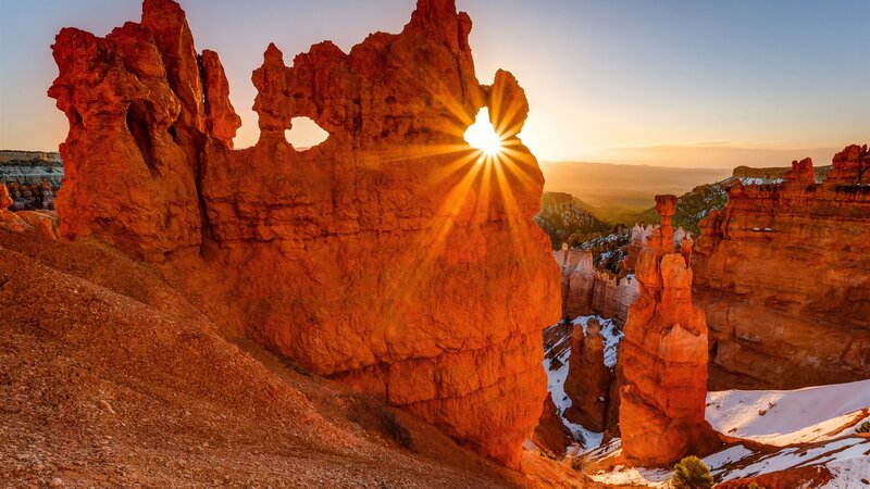 Sunrise Through Rock Formation