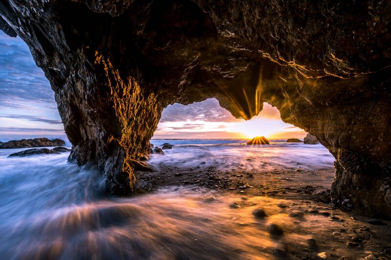 Sunrise Through Sea Cave — Orange