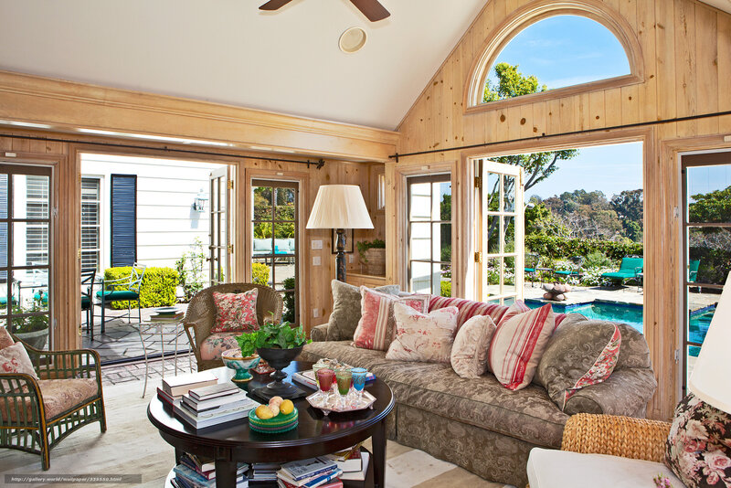 Sunroom with Sofa and Pool View