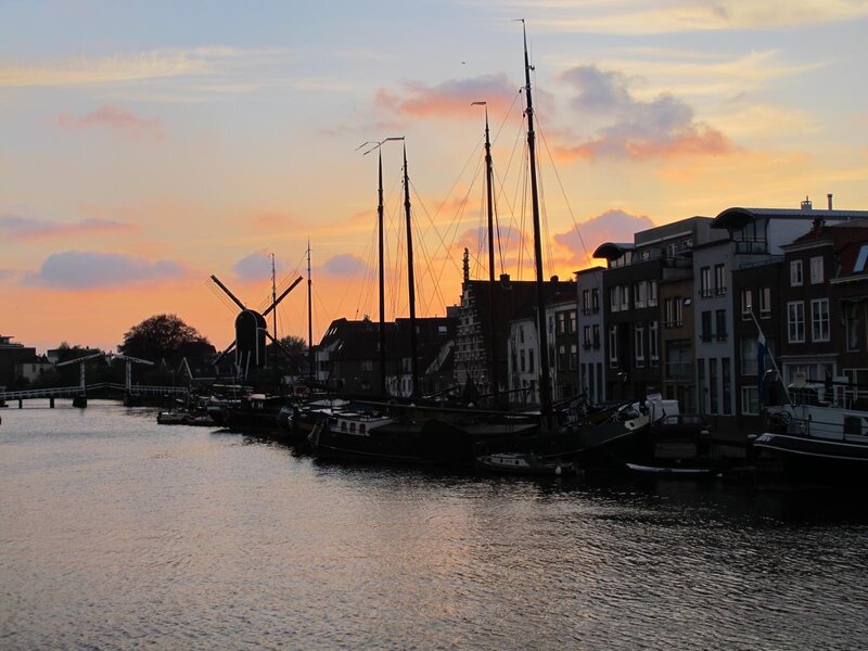 sunset at a canal with windmill