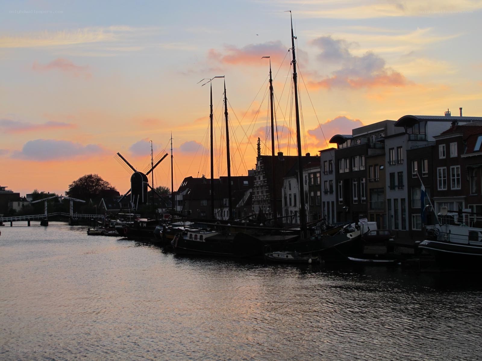 sunset at a canal with windmill