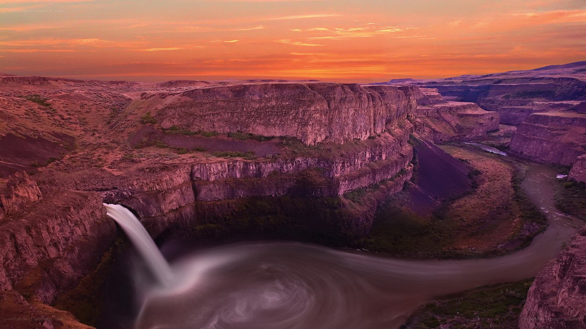 Sunset at a canyon waterfall