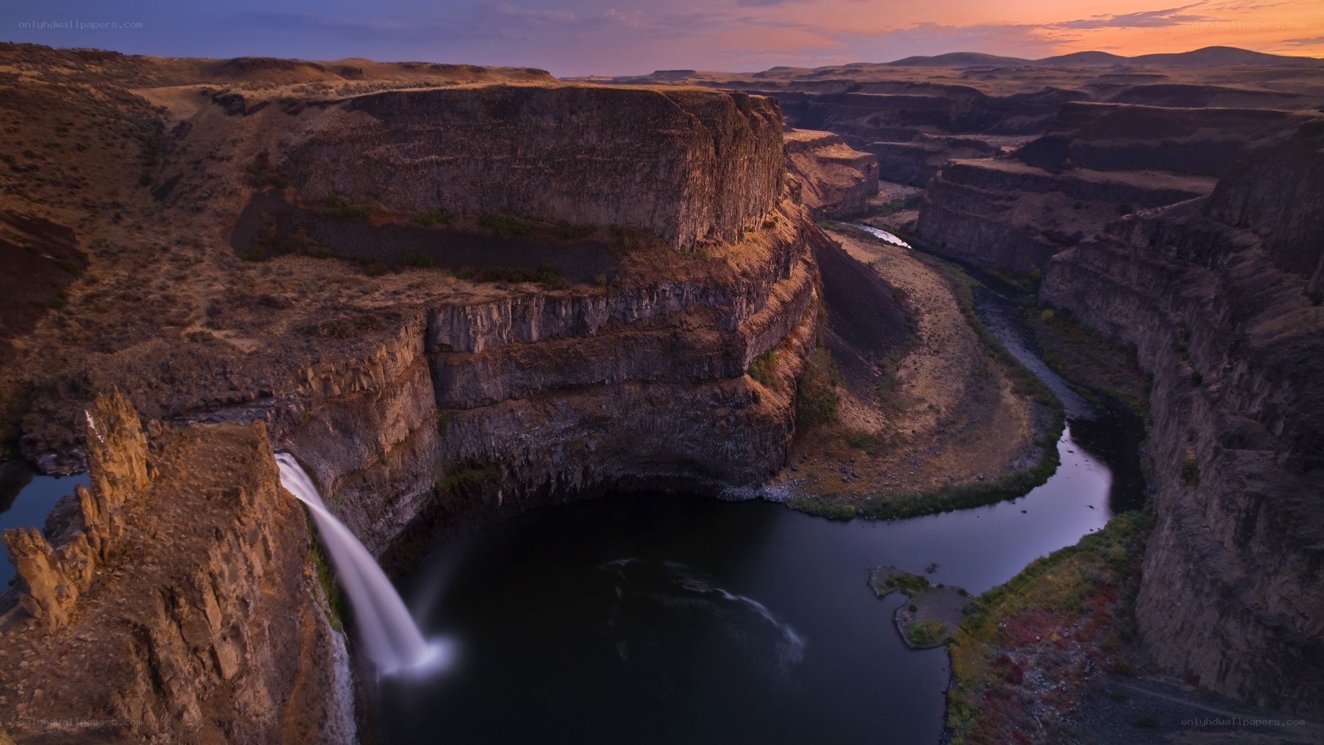 Sunset at a canyon waterfall