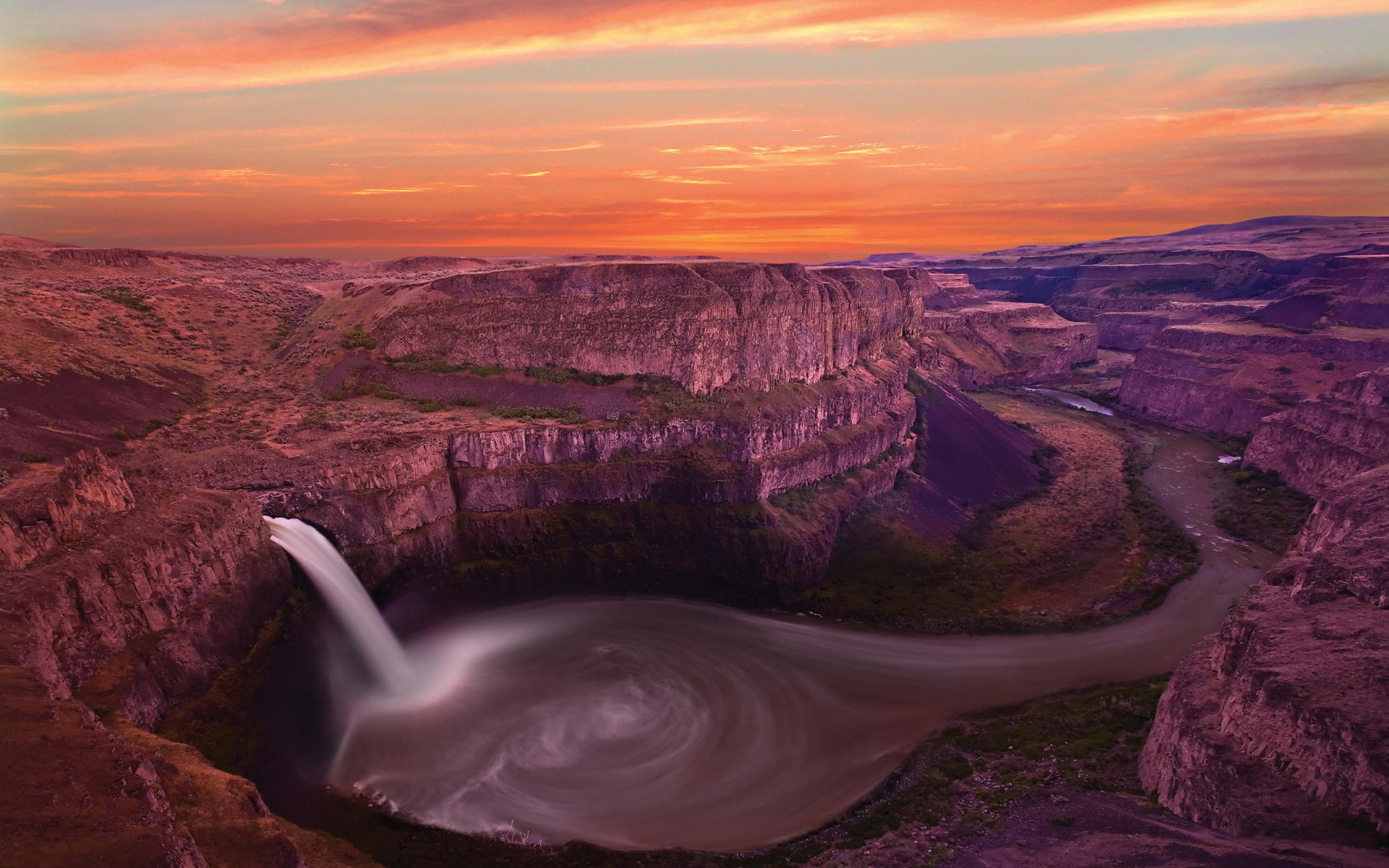 Sunset at a canyon waterfall