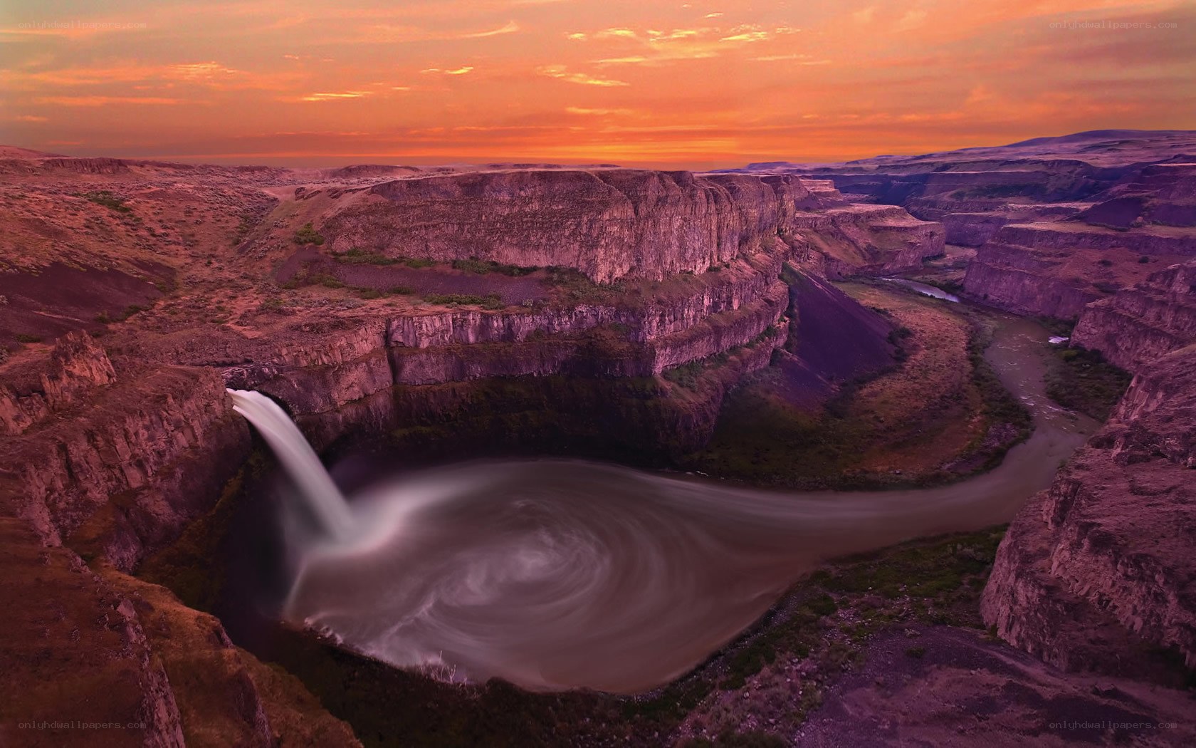 Sunset at a canyon waterfall