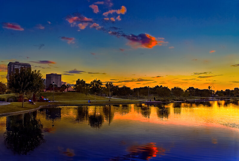 Sunset at a city park lake