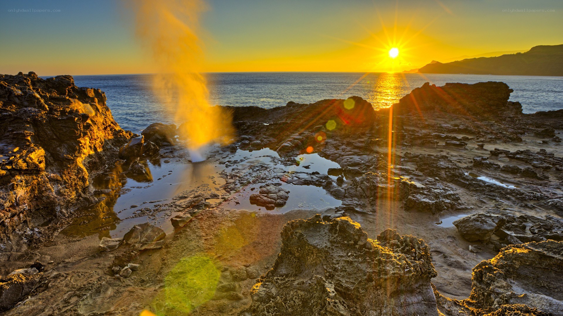 Sunset at a coastal geyser