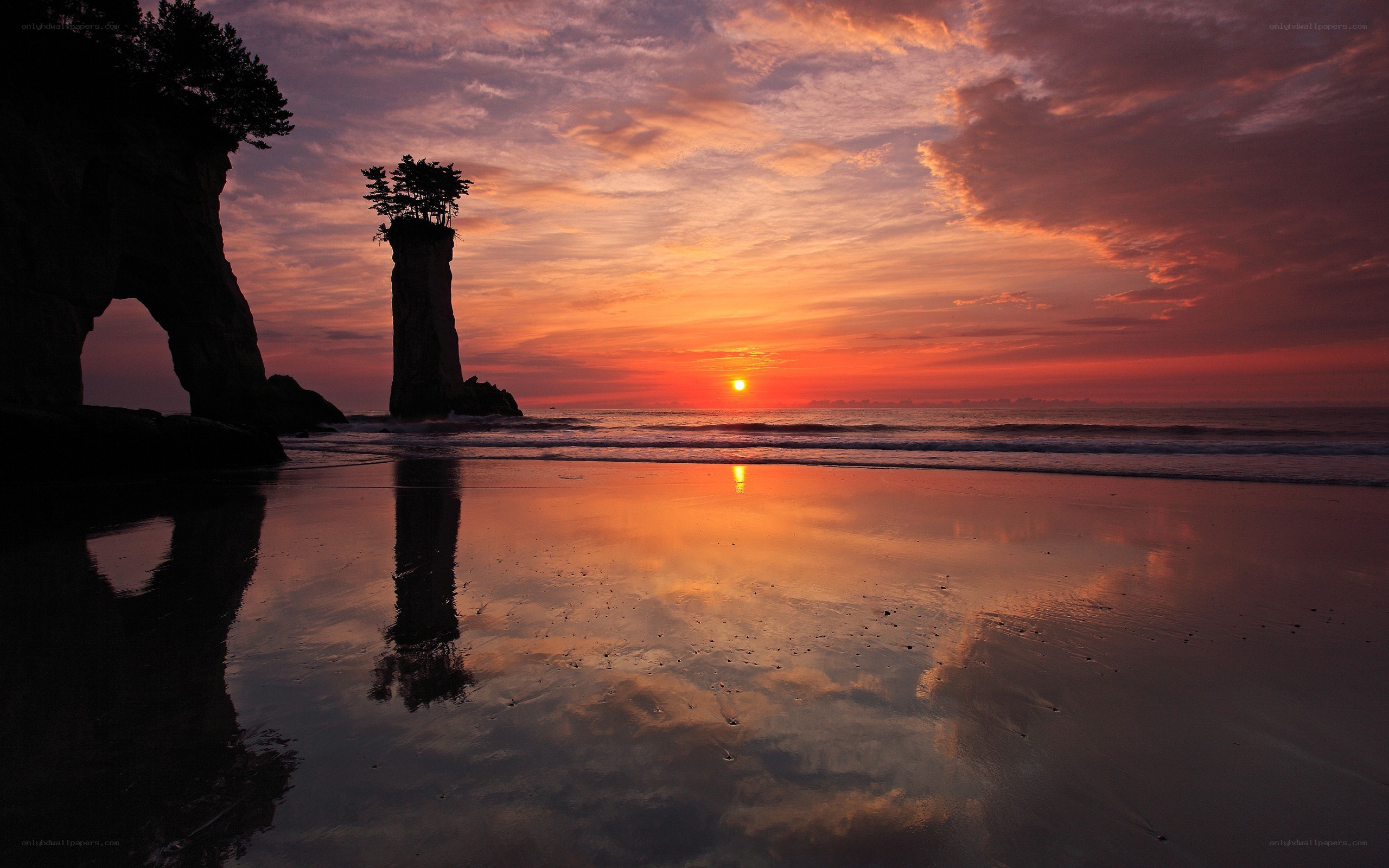 Sunset at a coastal rock formation
