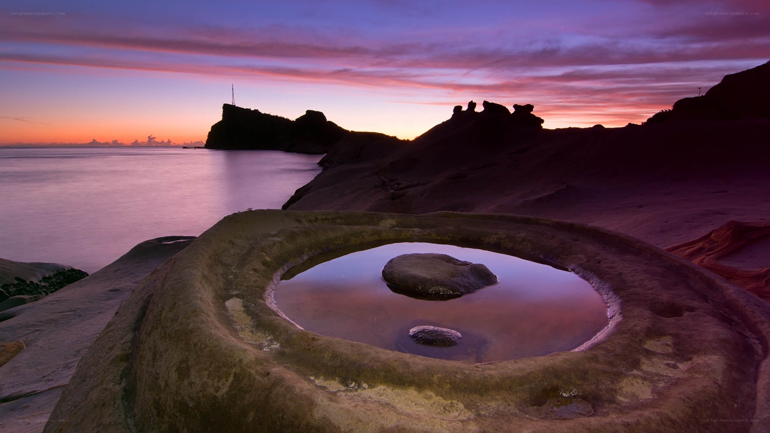 Sunset at a coastal rock pool