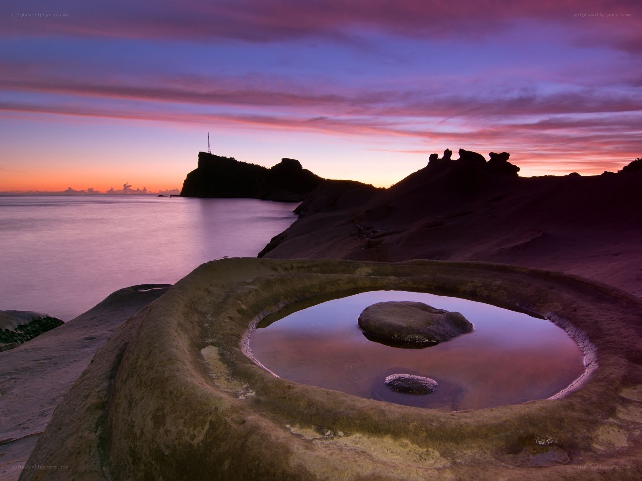Sunset at a coastal rock pool