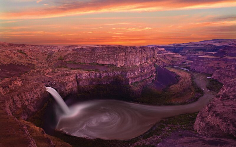 Sunset at a dramatic waterfall