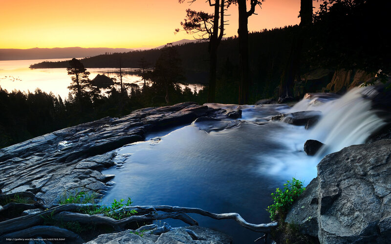 Sunset at a forest waterfall
