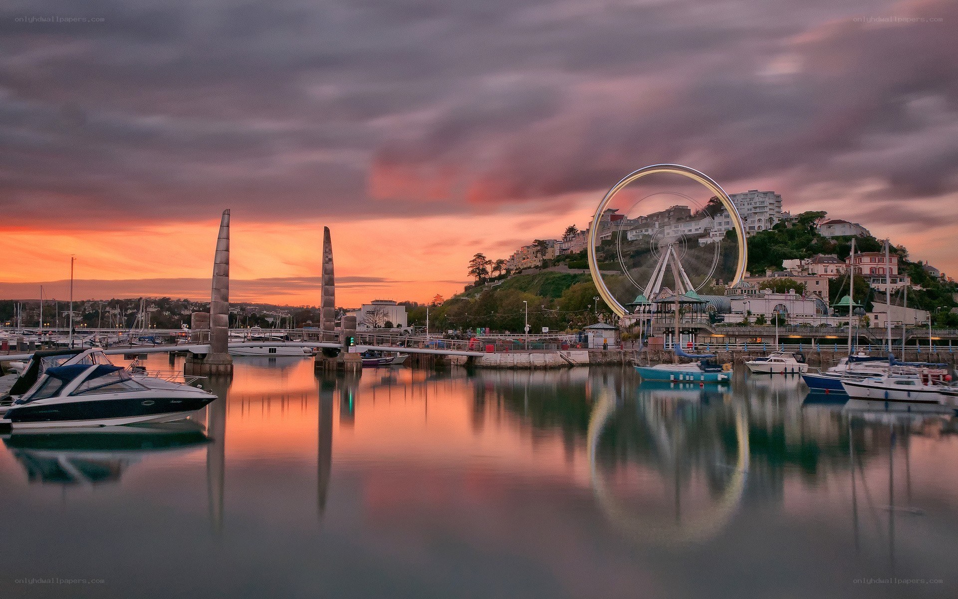 Sunset at a harbor with Ferris wheel