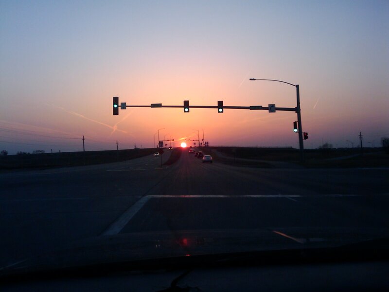Sunset at a highway intersection