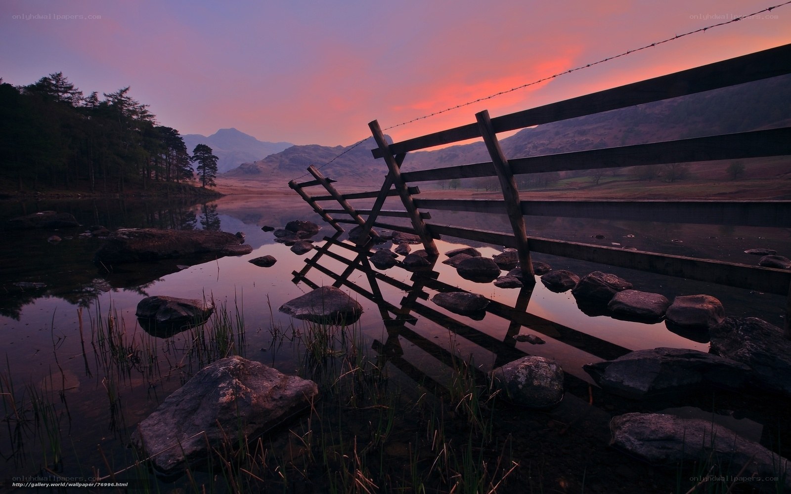 Sunset at a lakeside fence