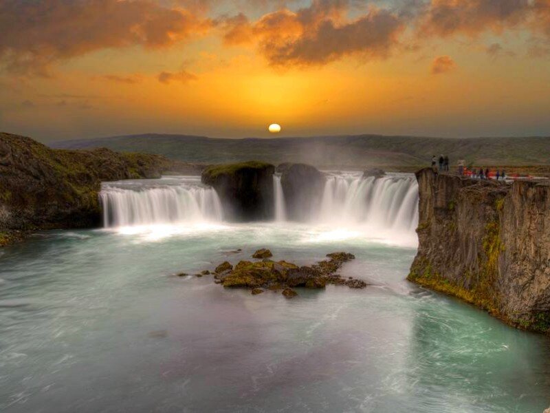 Sunset at a majestic waterfall