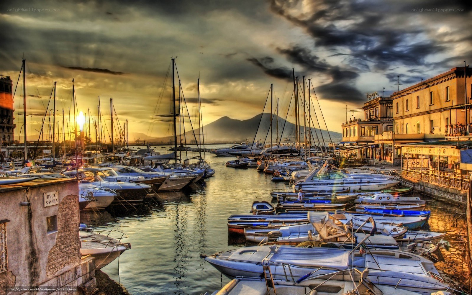 Sunset at a marina with boats