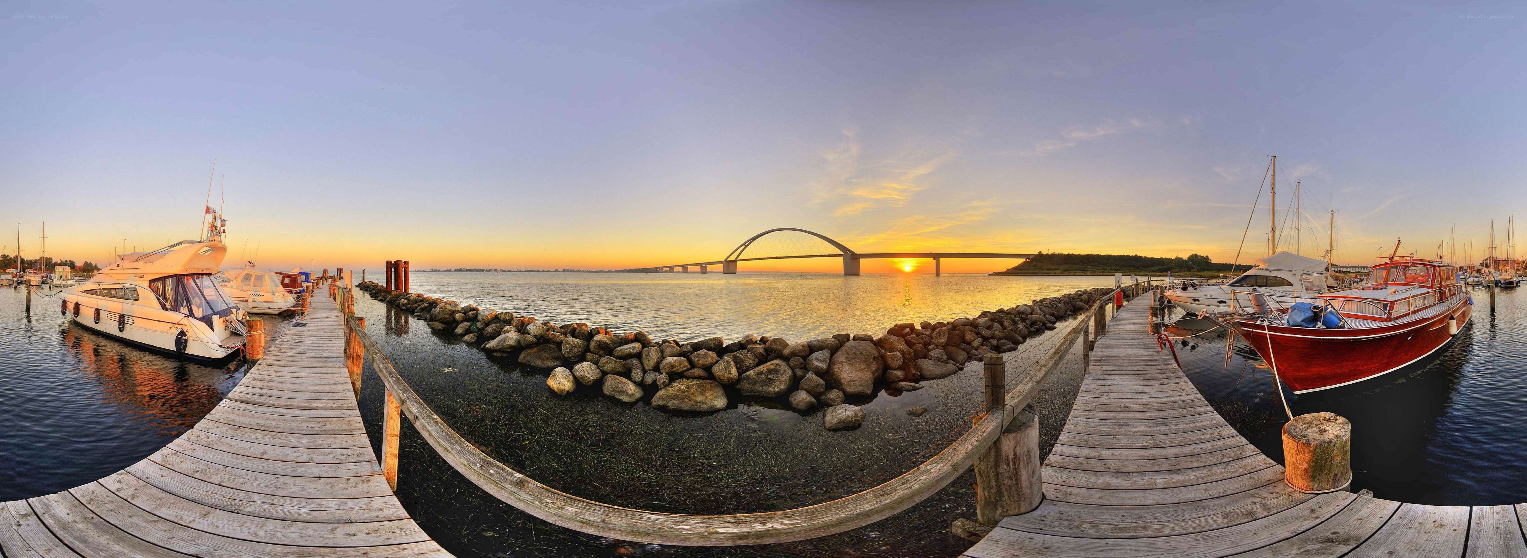 Sunset at a marina with bridge