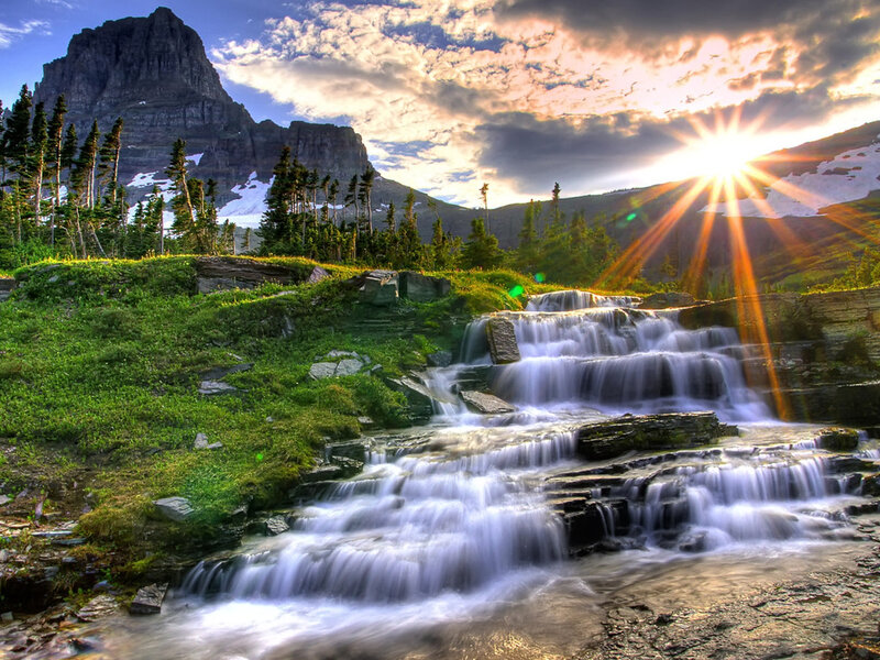 Sunset at a mountain waterfall