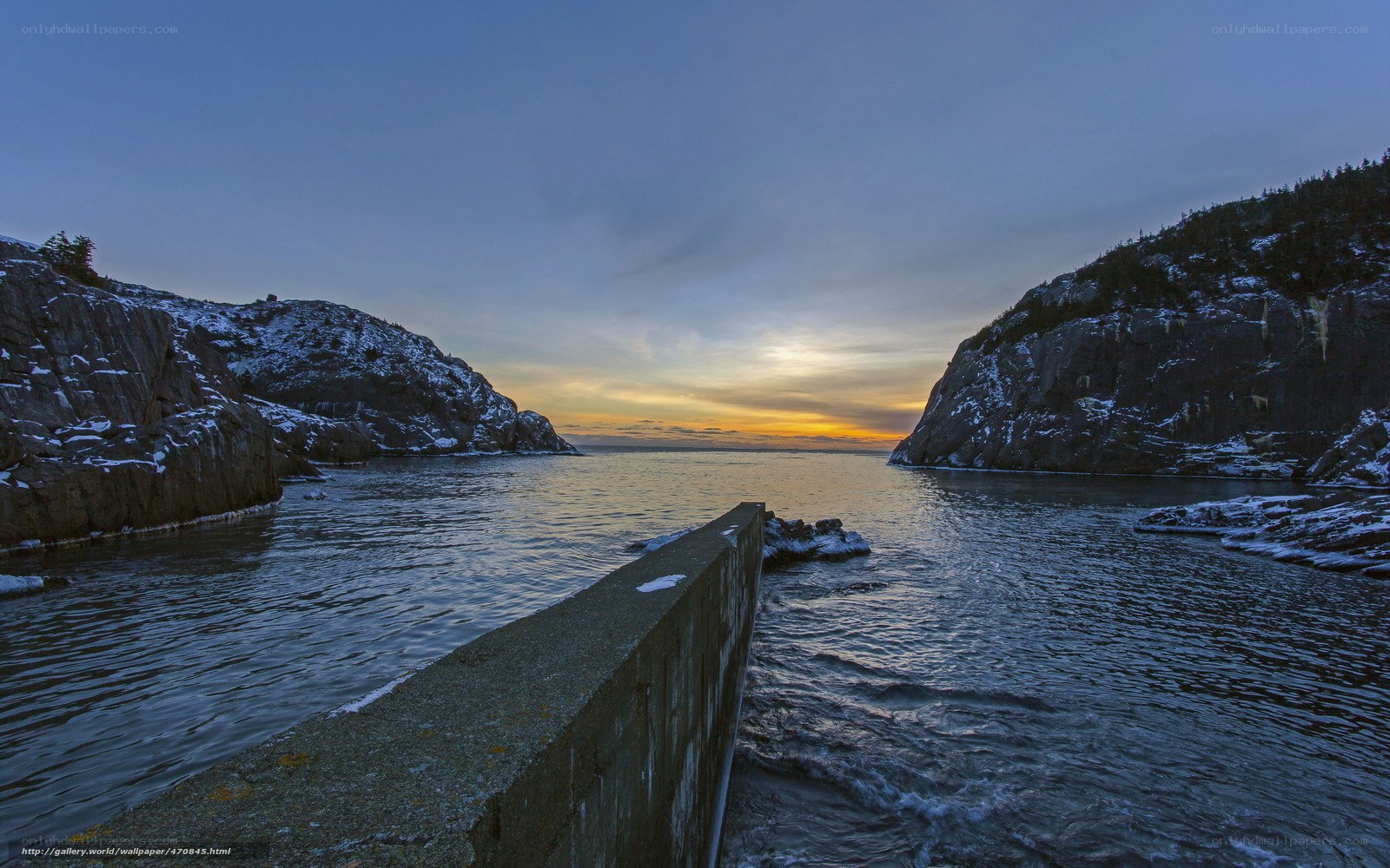 Sunset at a rocky coastal inlet