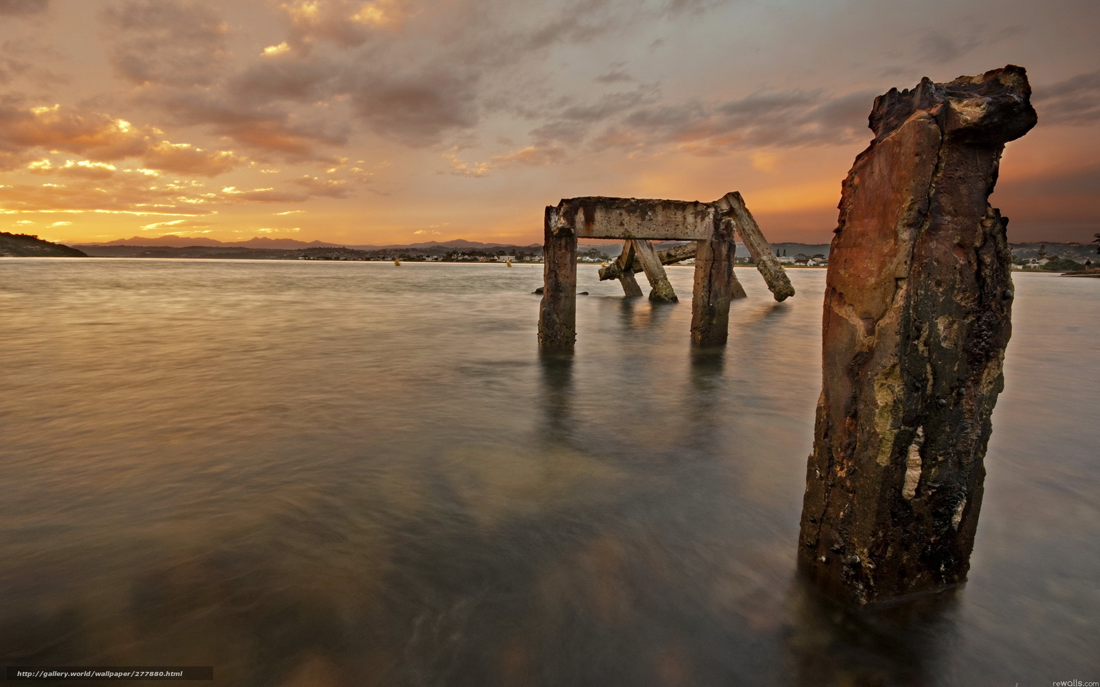 Sunset at a ruined pier