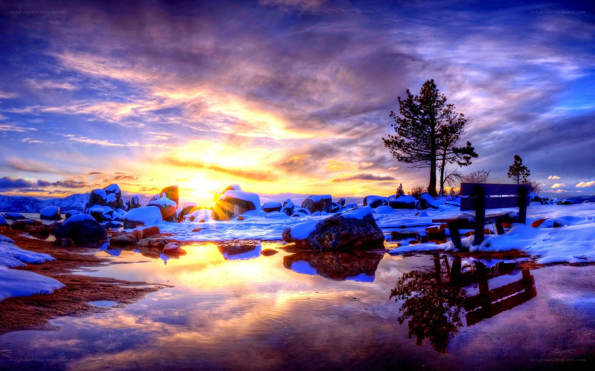 Sunset at a snowy lakeside