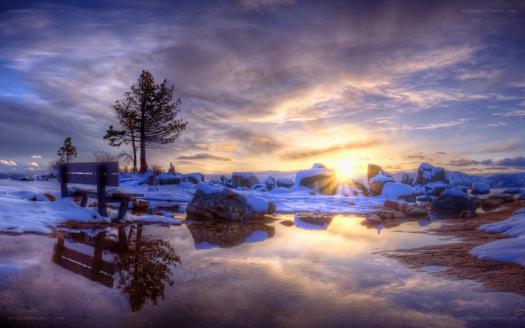 Sunset at a snowy lakeside