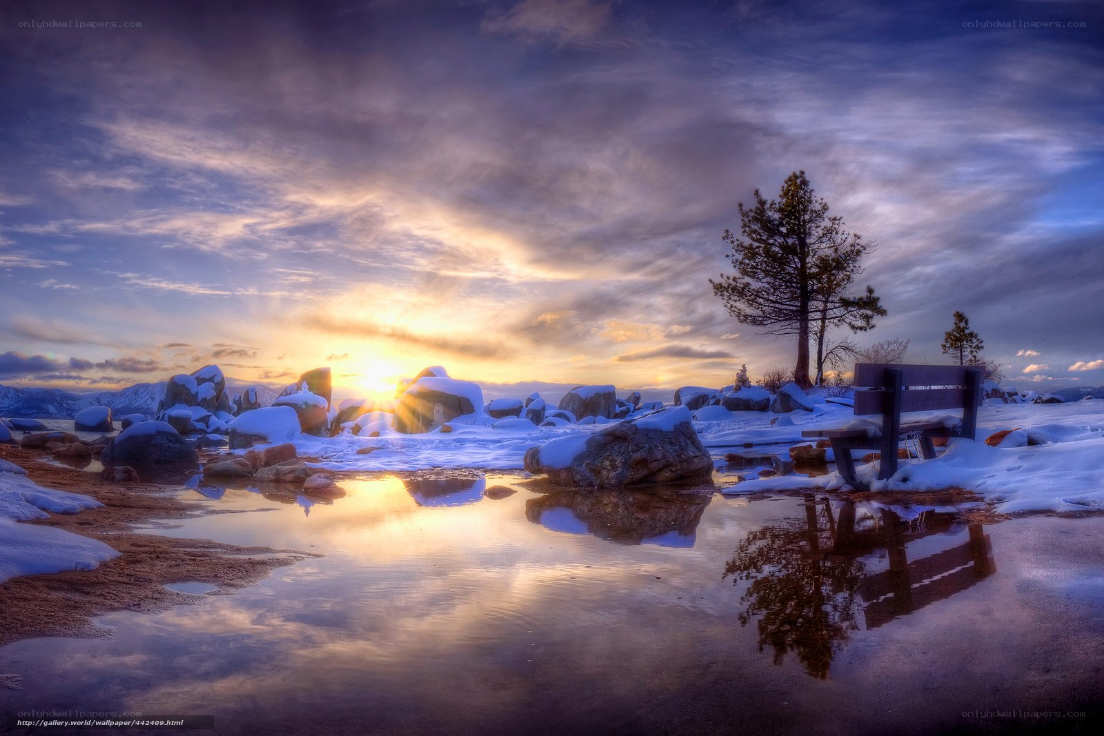 Sunset at a snowy lakeside